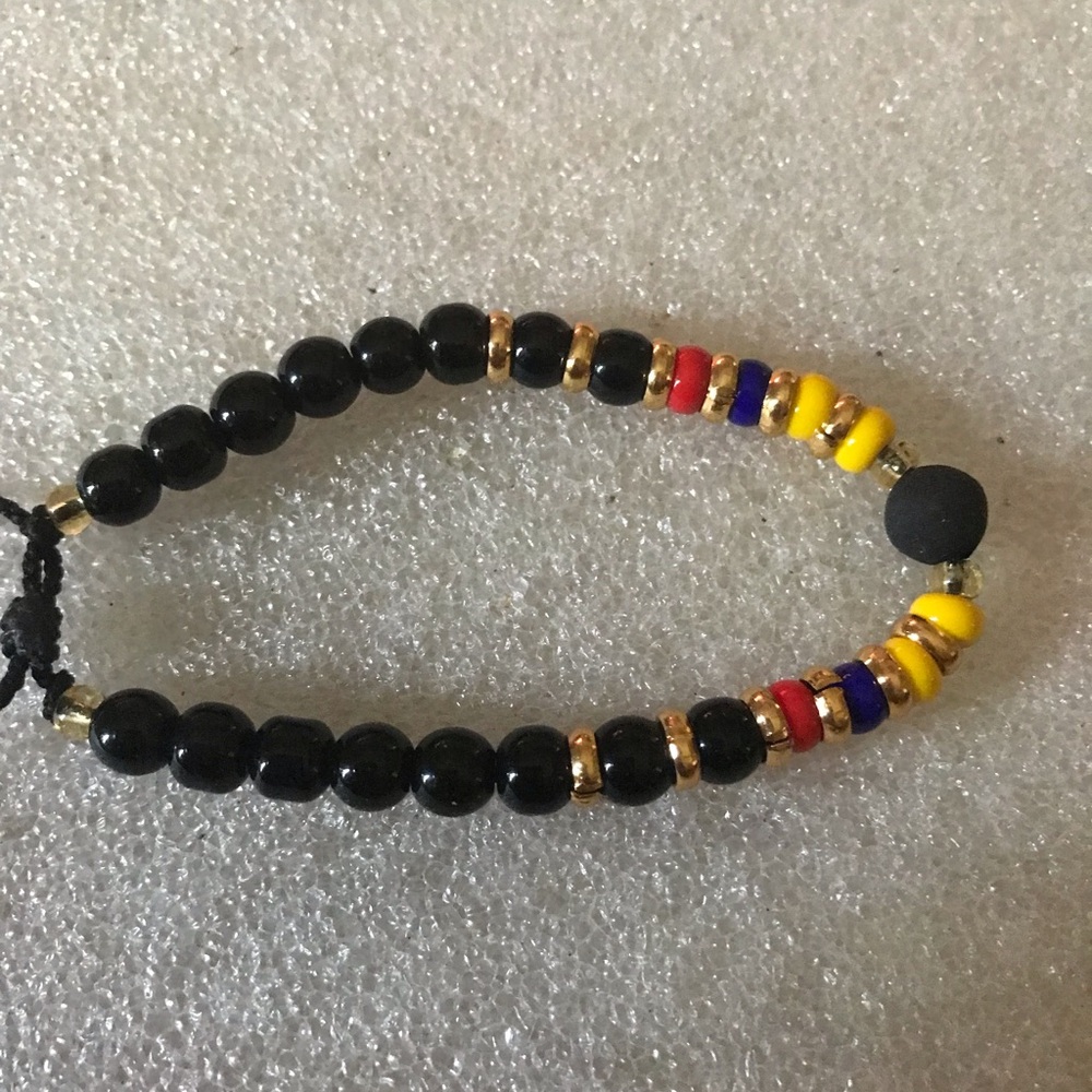 Black Beaded Adjustable Bracelet with Red, Blue & Yellow Accents